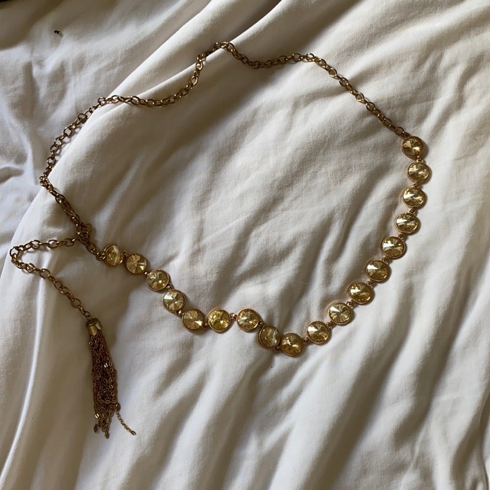 Reversible gold belt with hook closure and tassel